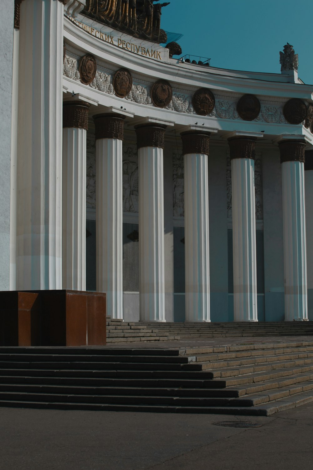 a building with pillars and stairs