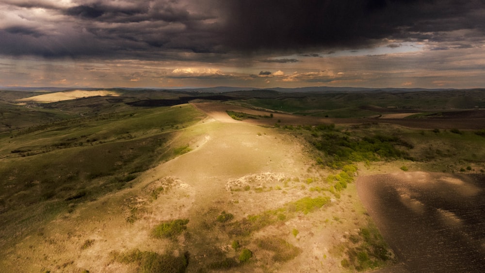 a dirt road in a field