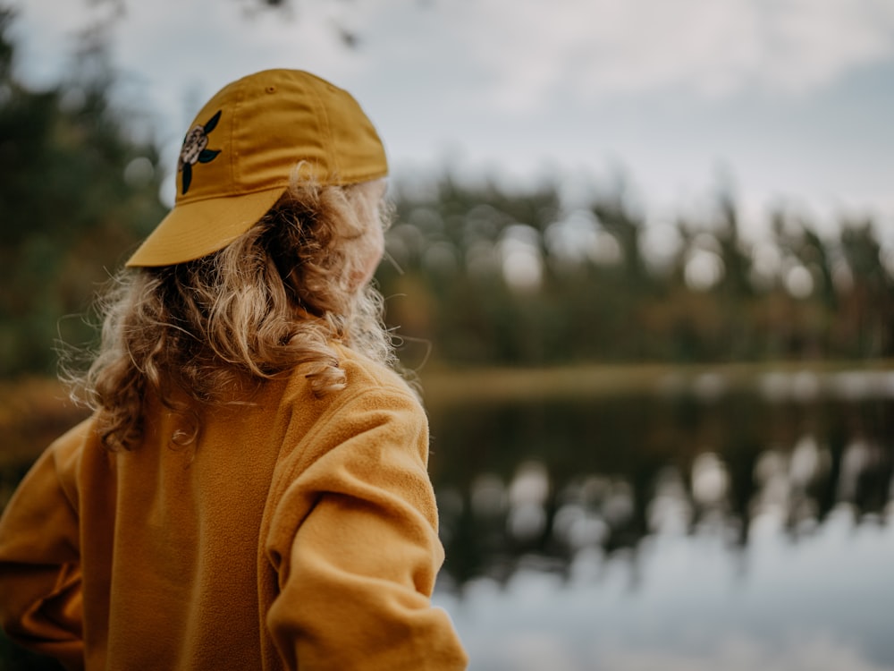 a person looking at a lake