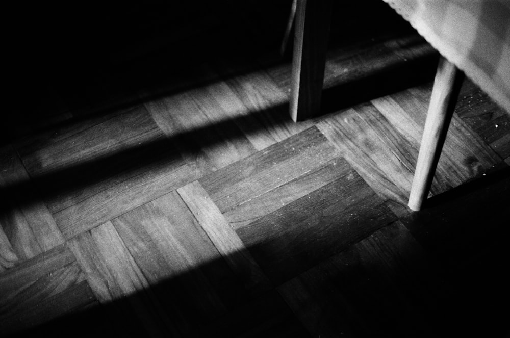 a wooden bench with a shadow