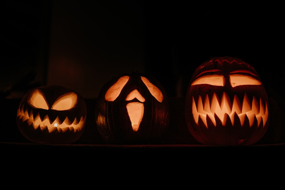 a group of carved pumpkins