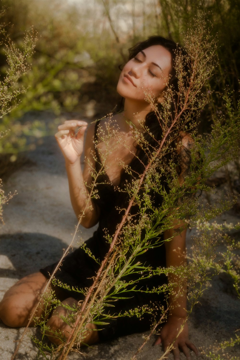 a woman sitting on a rock