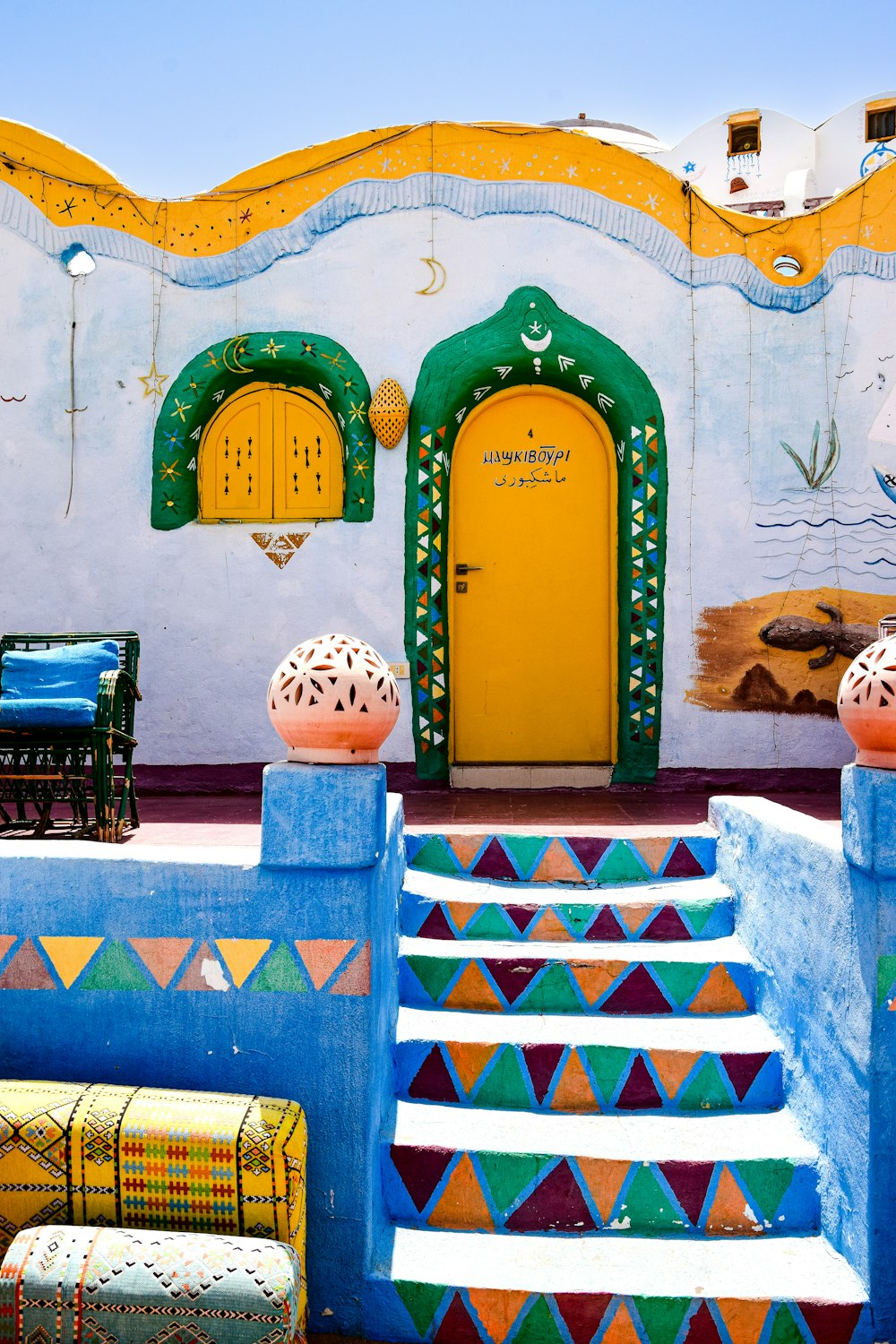 a colorful building with a yellow door