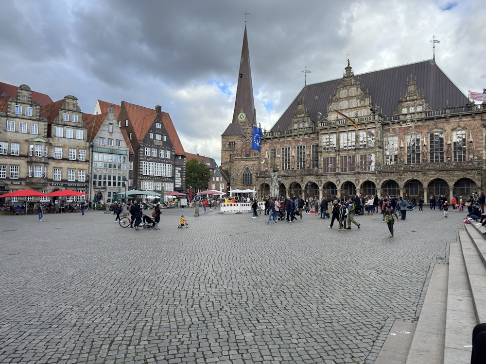 a large brick courtyard with buildings around it