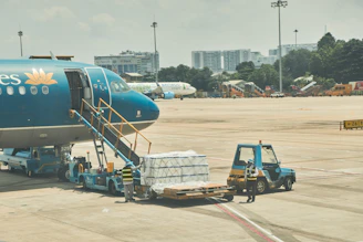 a person standing next to an airplane
