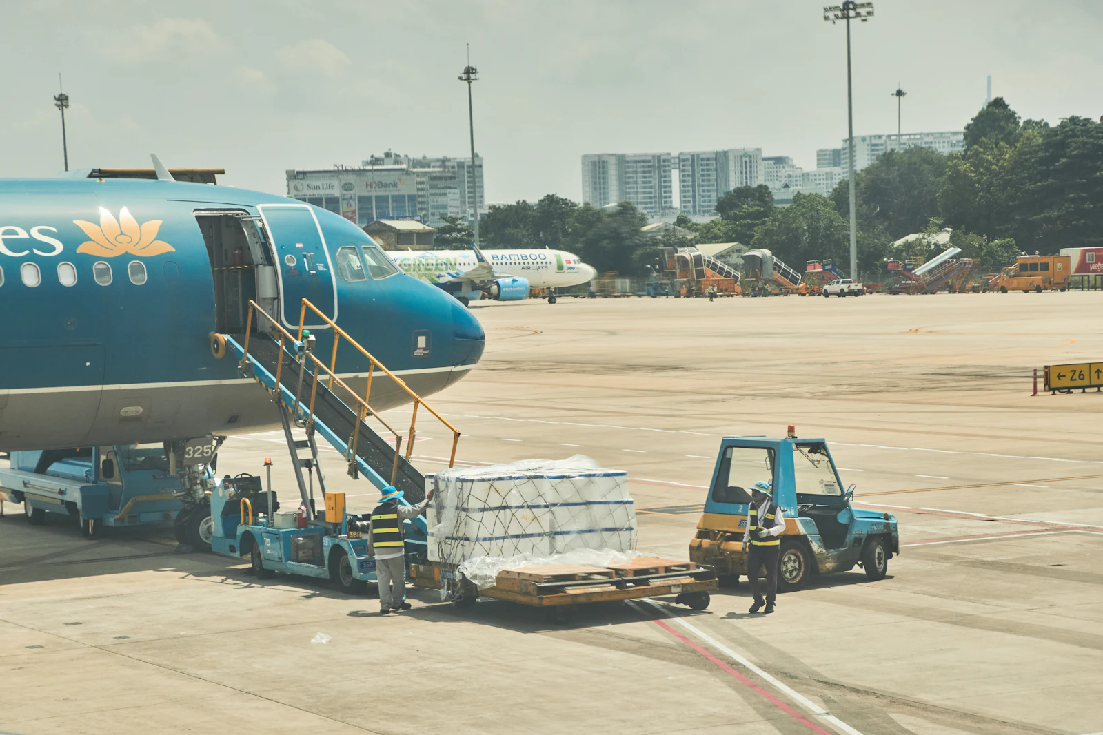 Traveller standing near an aircraft at an airport in Vietnam