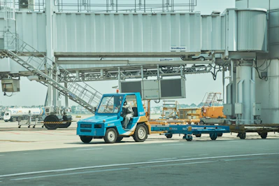 a blue truck with a crane