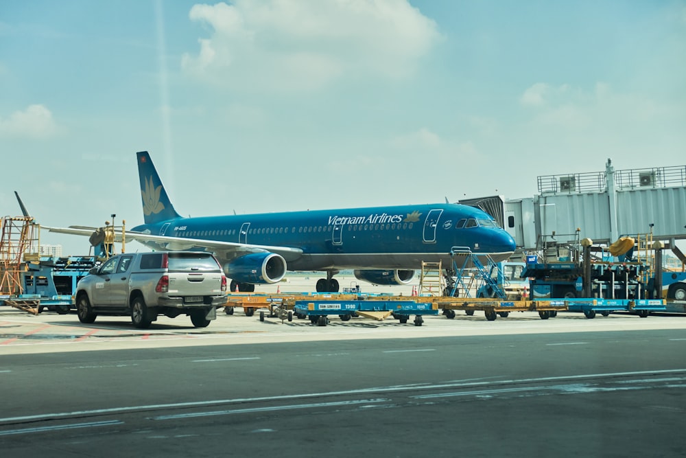 a large blue airplane on the runway