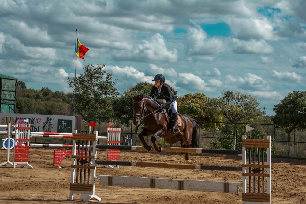 a person riding a horse in a competition