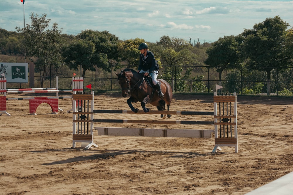 a man riding a horse in a competition