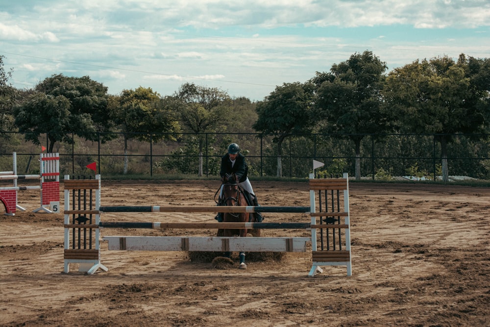 a person riding a horse in a competition