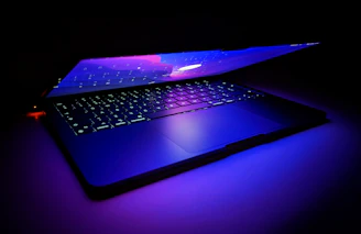 Close-up of a luxury tech device glowing with electric violet and blue light accents.