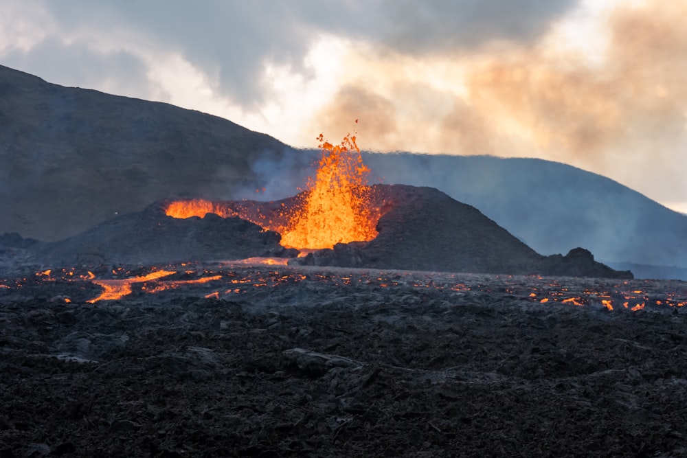 a volcano erupting at sunset