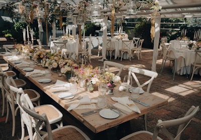 a large room with tables set for a wedding