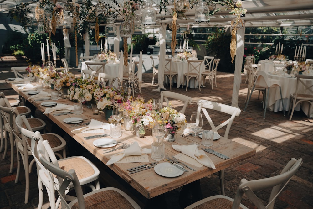 a large room with tables set for a wedding