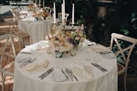 a table set with plates and silverware