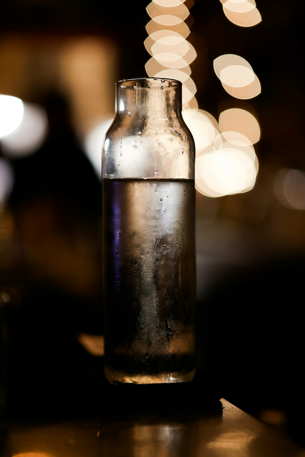 a glass bottle with a clear liquid