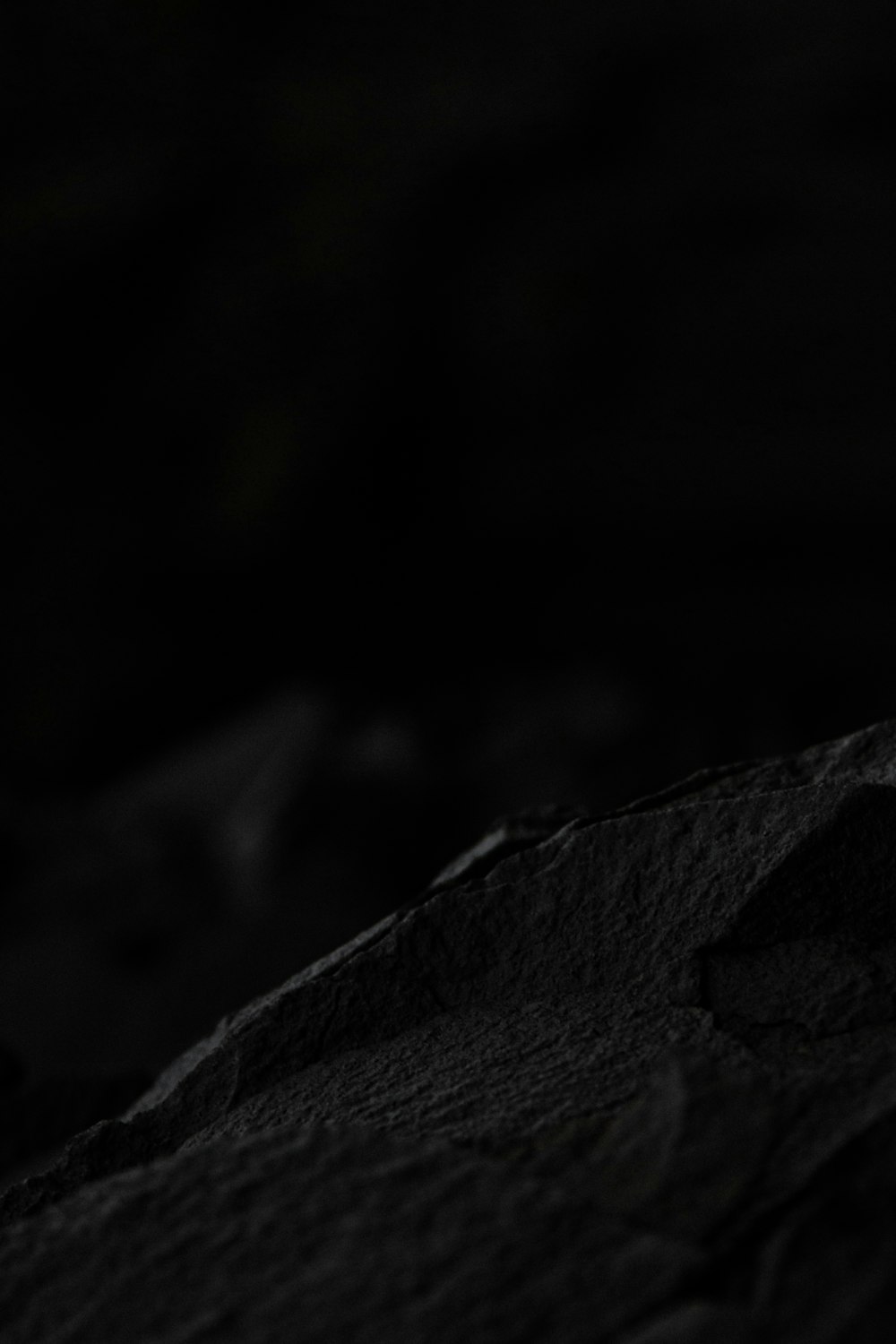 a dark rocky surface