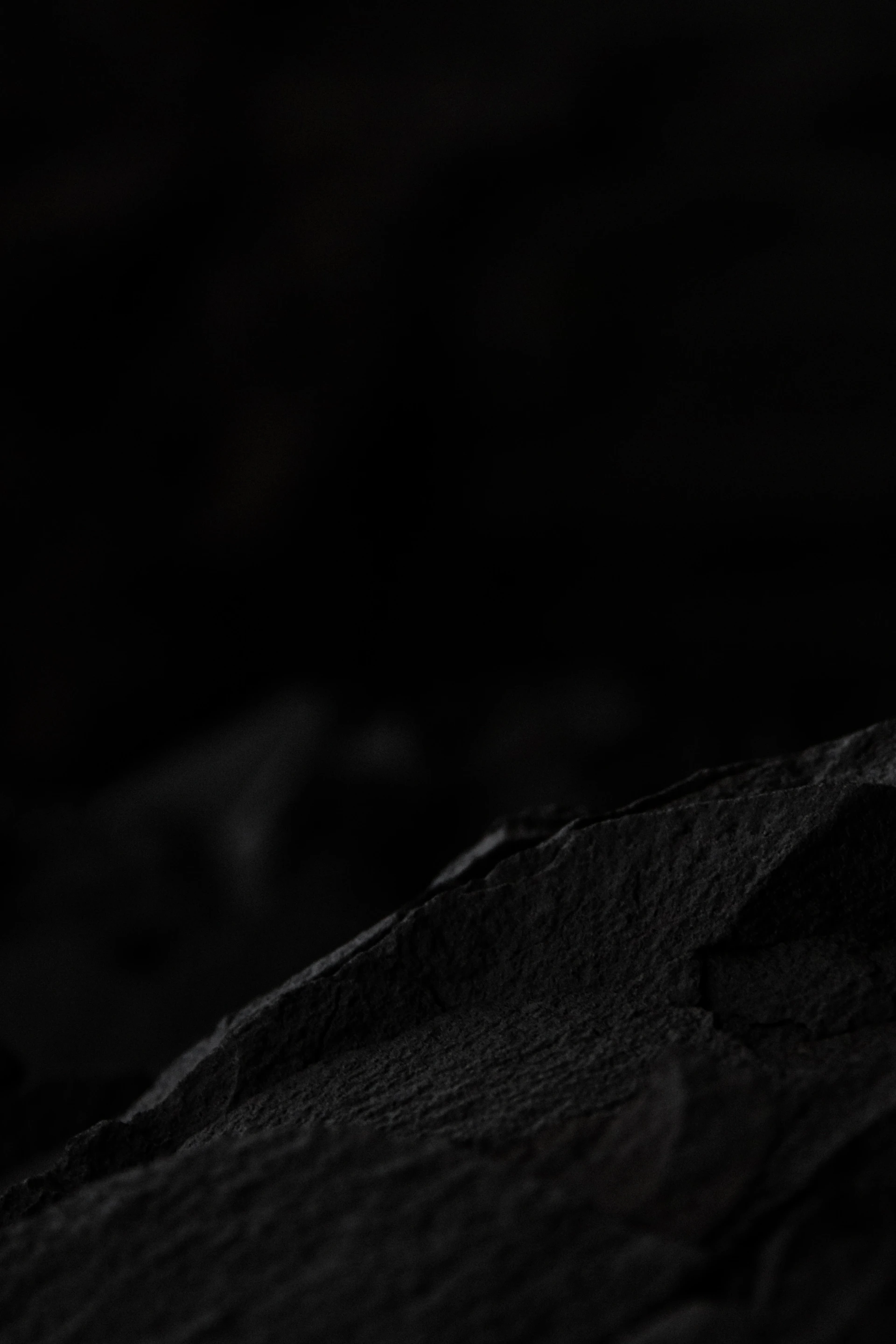 a dark rocky surface