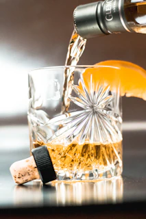 a glass of liquid being poured into a glass