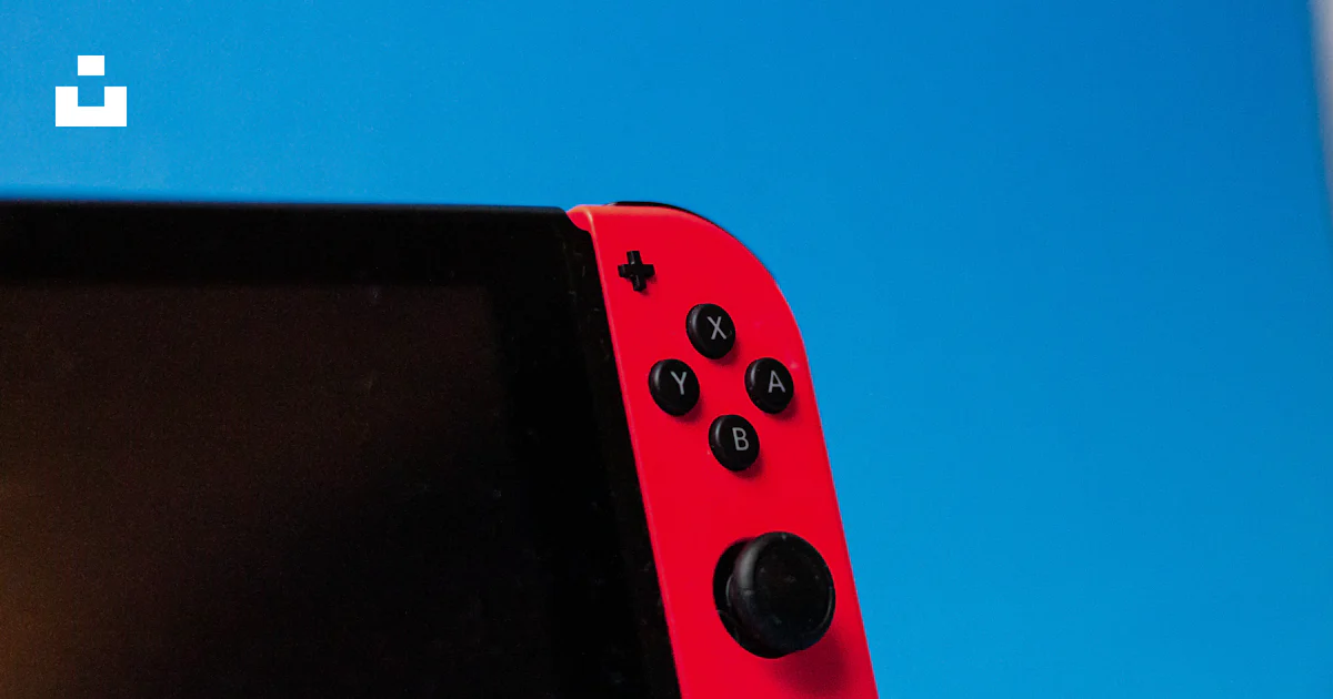 Nintendo Retangle Controller A red rectangular object with black buttons photo – Free Nintendo ...