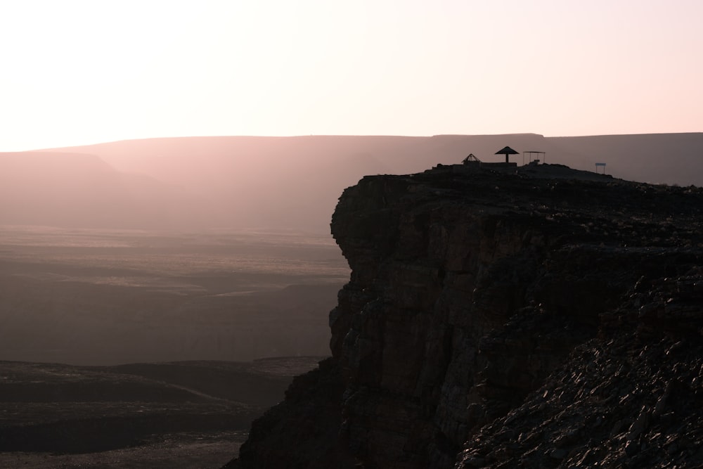 a cliff with a building on it