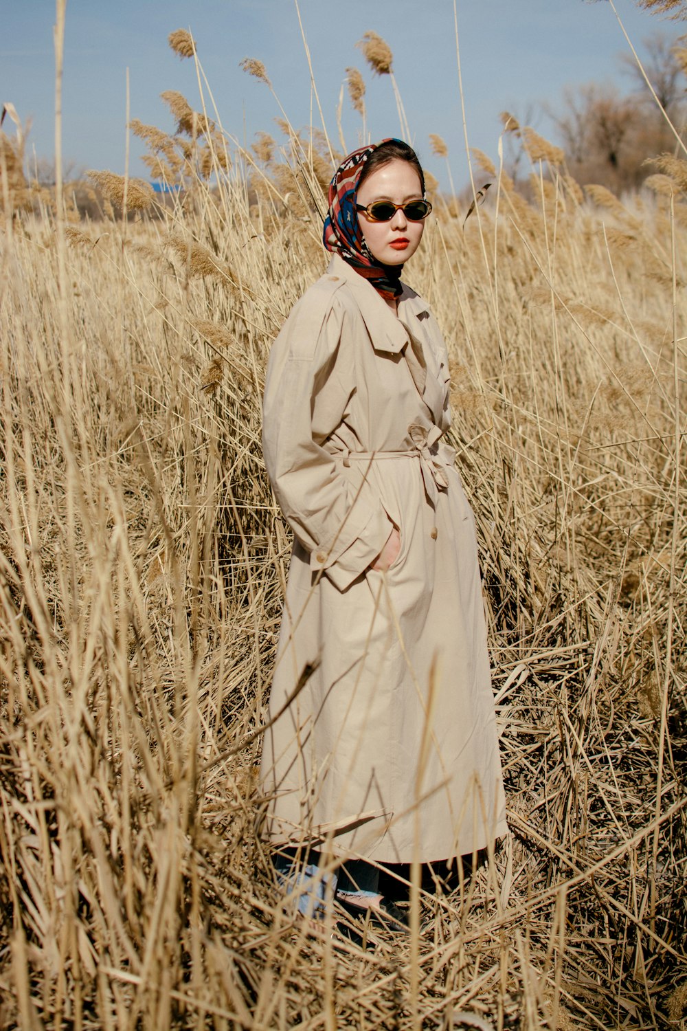 a man standing in a field of tall grass