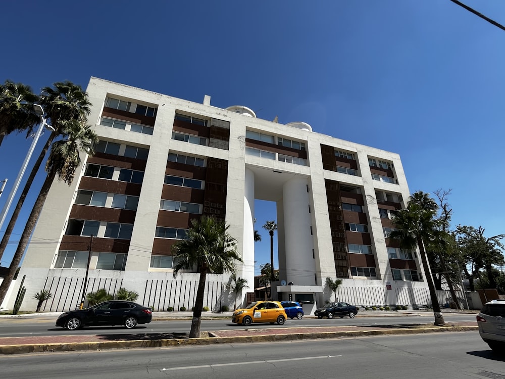 a building with cars parked in front