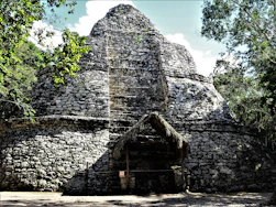 a stone building with a door