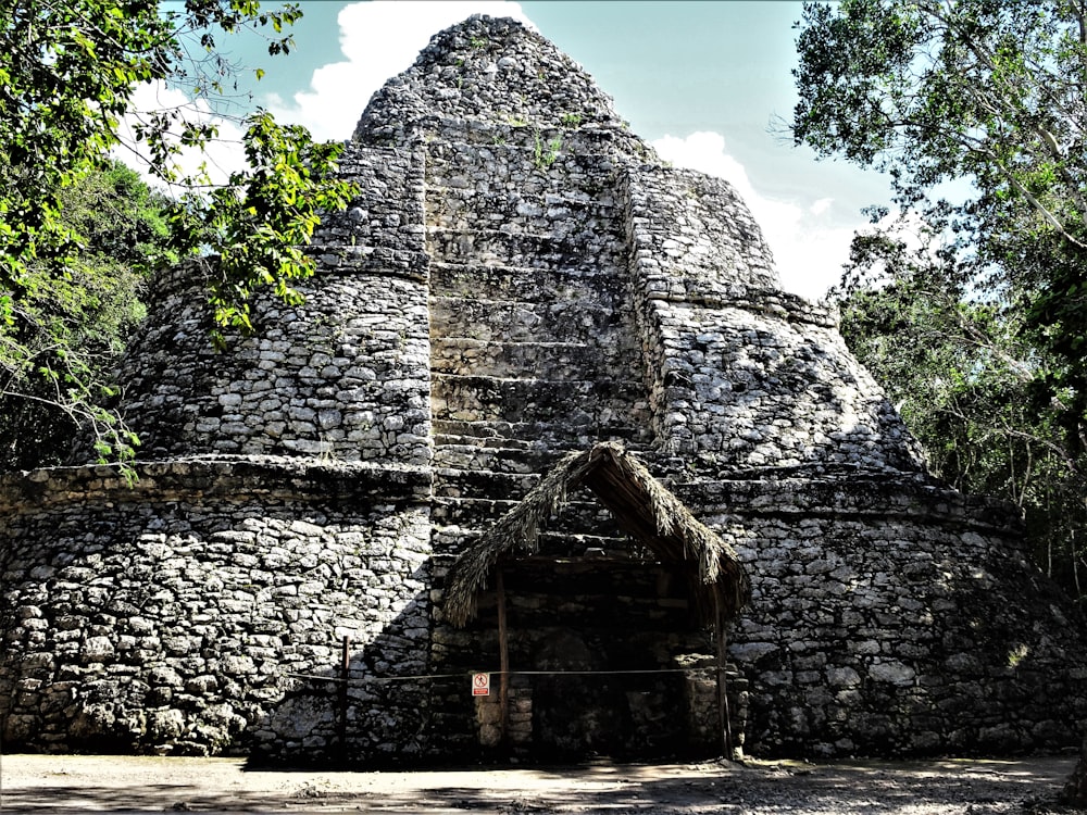 a stone building with a door