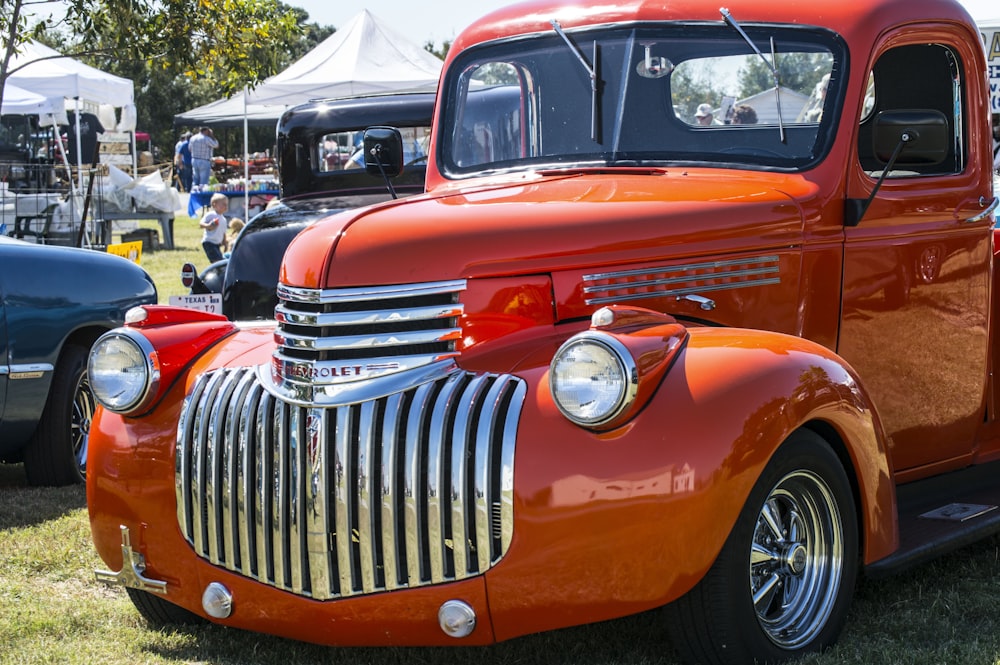 a red truck parked in a field