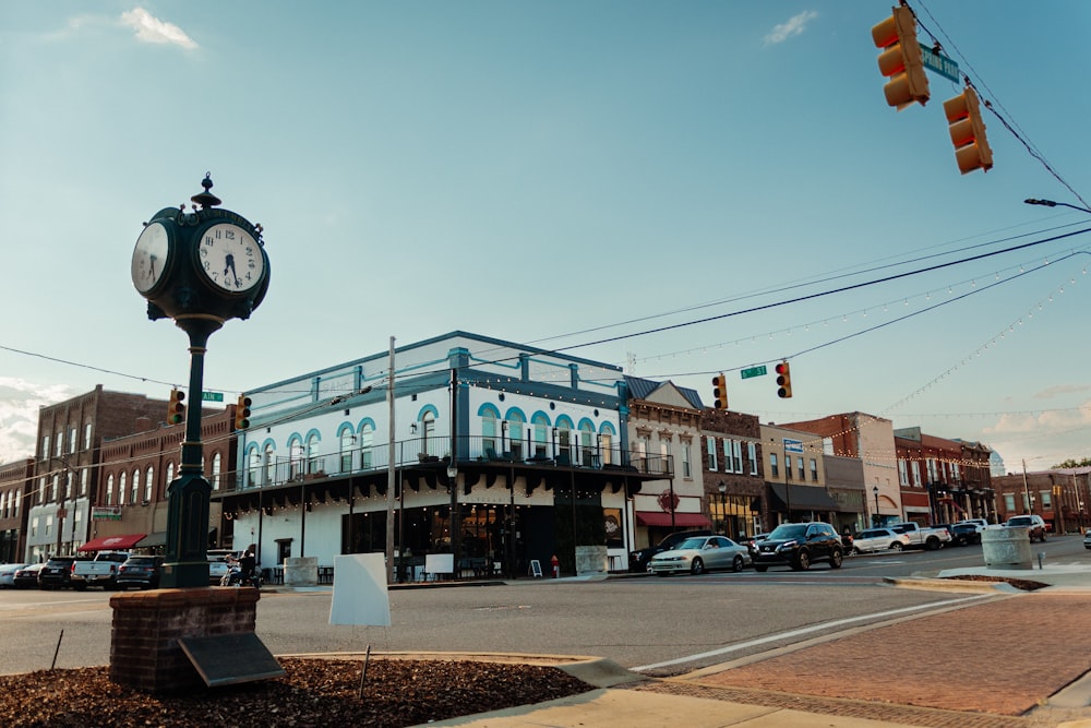 a clock on a pole in a city