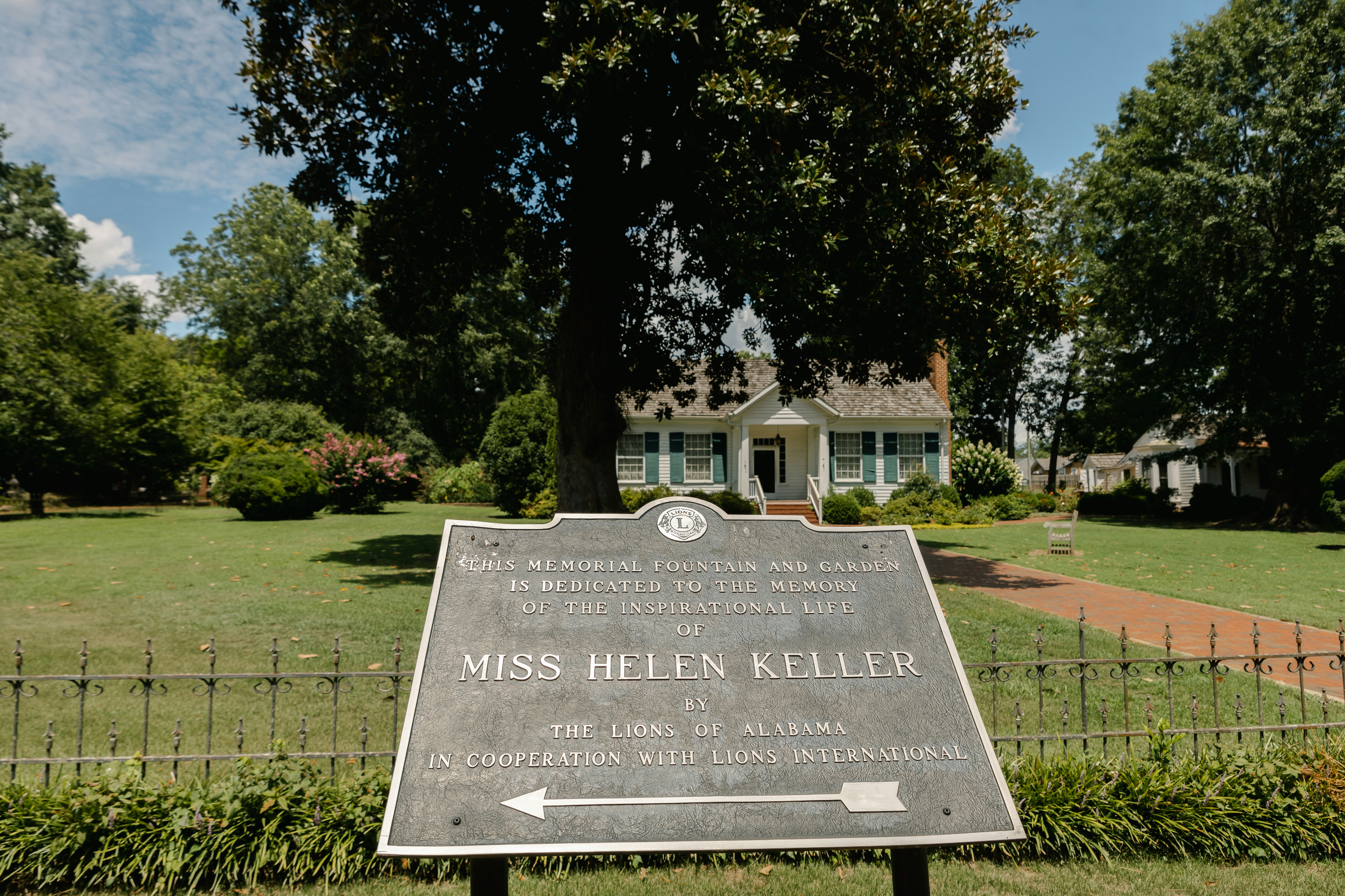 a sign in front of a house