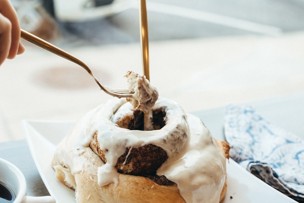 a spoon in a cup of ice cream