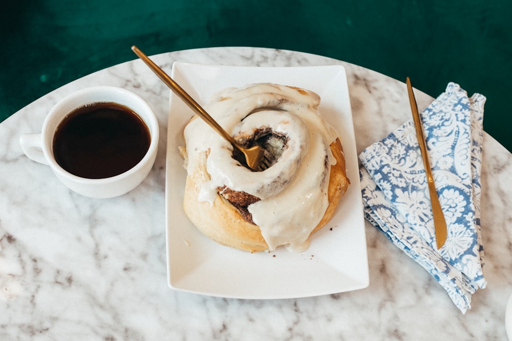 a plate with food and a cup of coffee