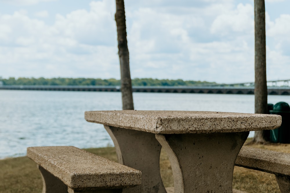 a bench sits by the water