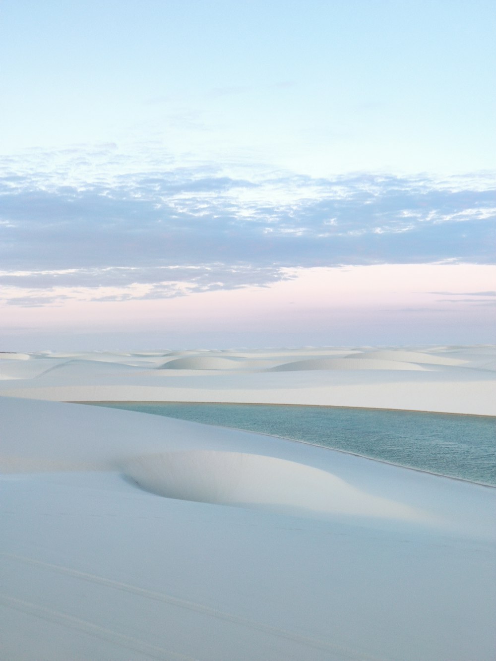 a beach with a body of water