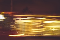 Print artwork capturing the energy of motorsport through fragmented shapes and light streaks.