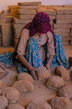 a person sitting on a pile of rocks