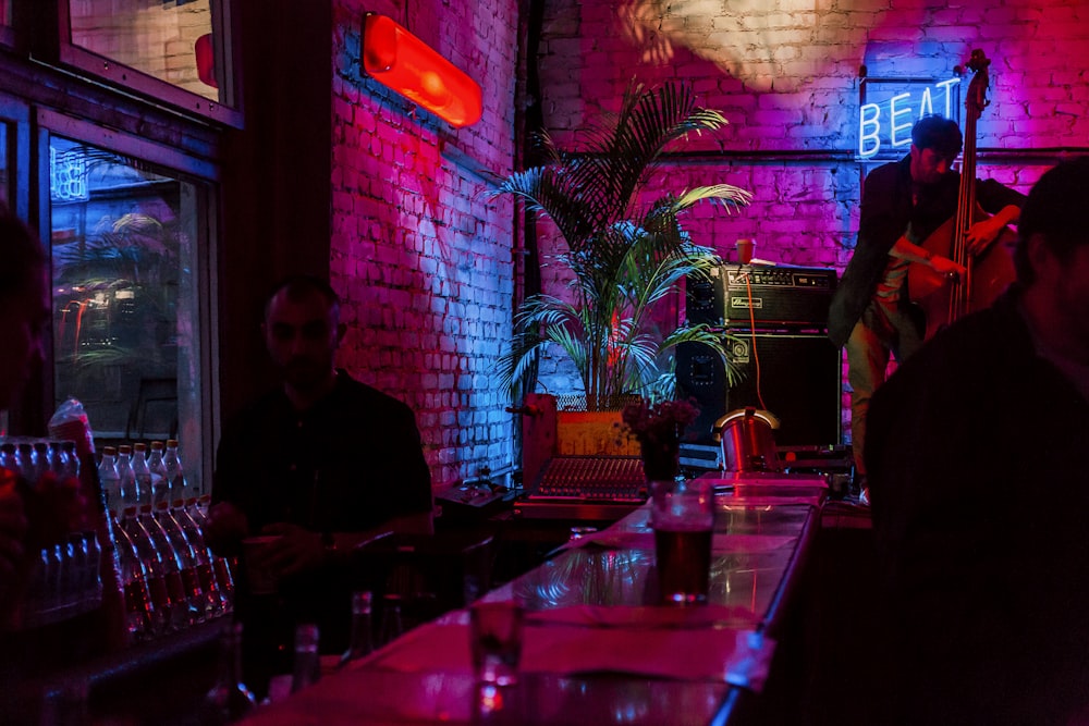 a group of people sitting at a table with drinks