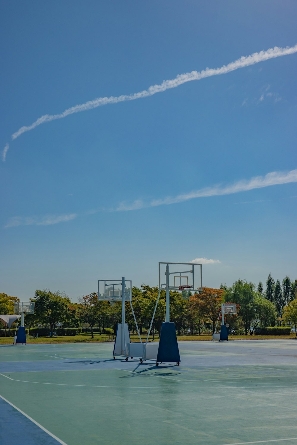 a basketball court with a blue sky