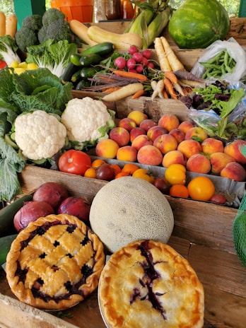 A colorful spread of fresh fruits and vegetables on a wooden table.