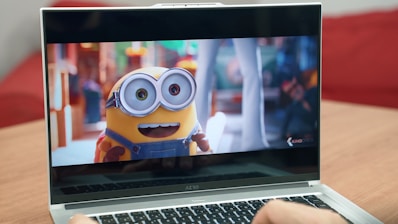 a laptop with a cartoon character on the screen