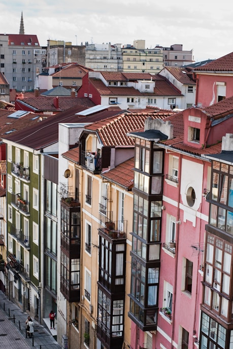 a group of buildings with red roofs