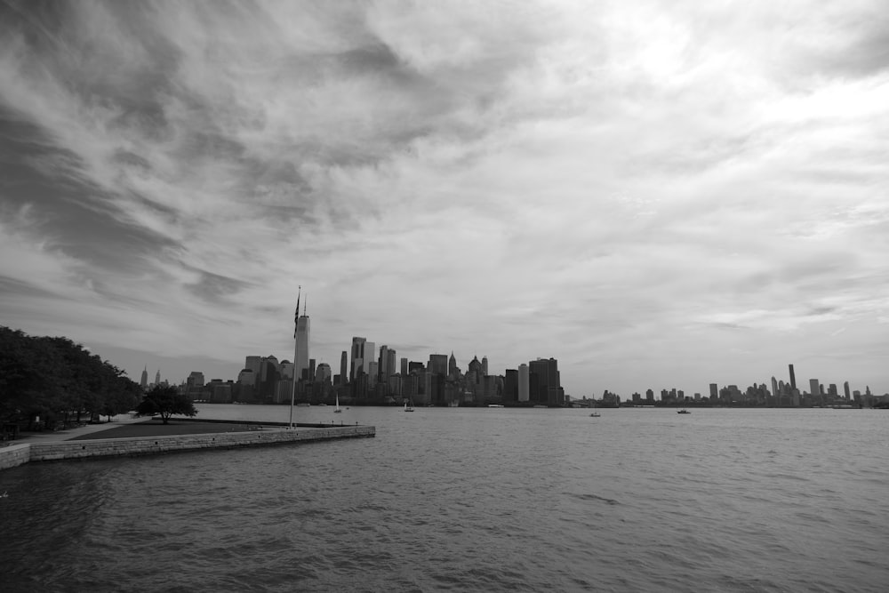 a body of water with a city in the background