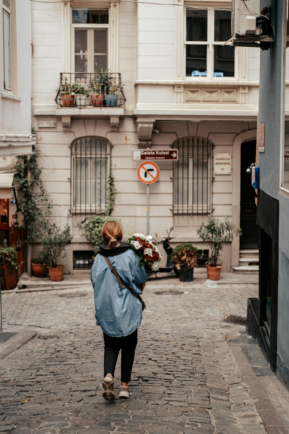 a person walking down a sidewalk