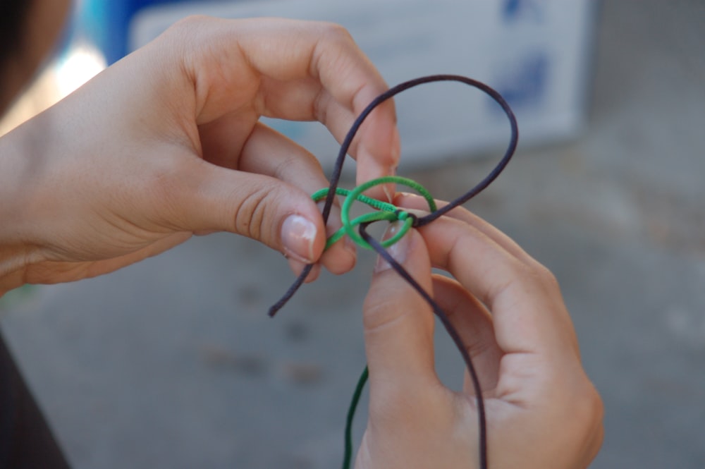 a person holding a pair of glasses