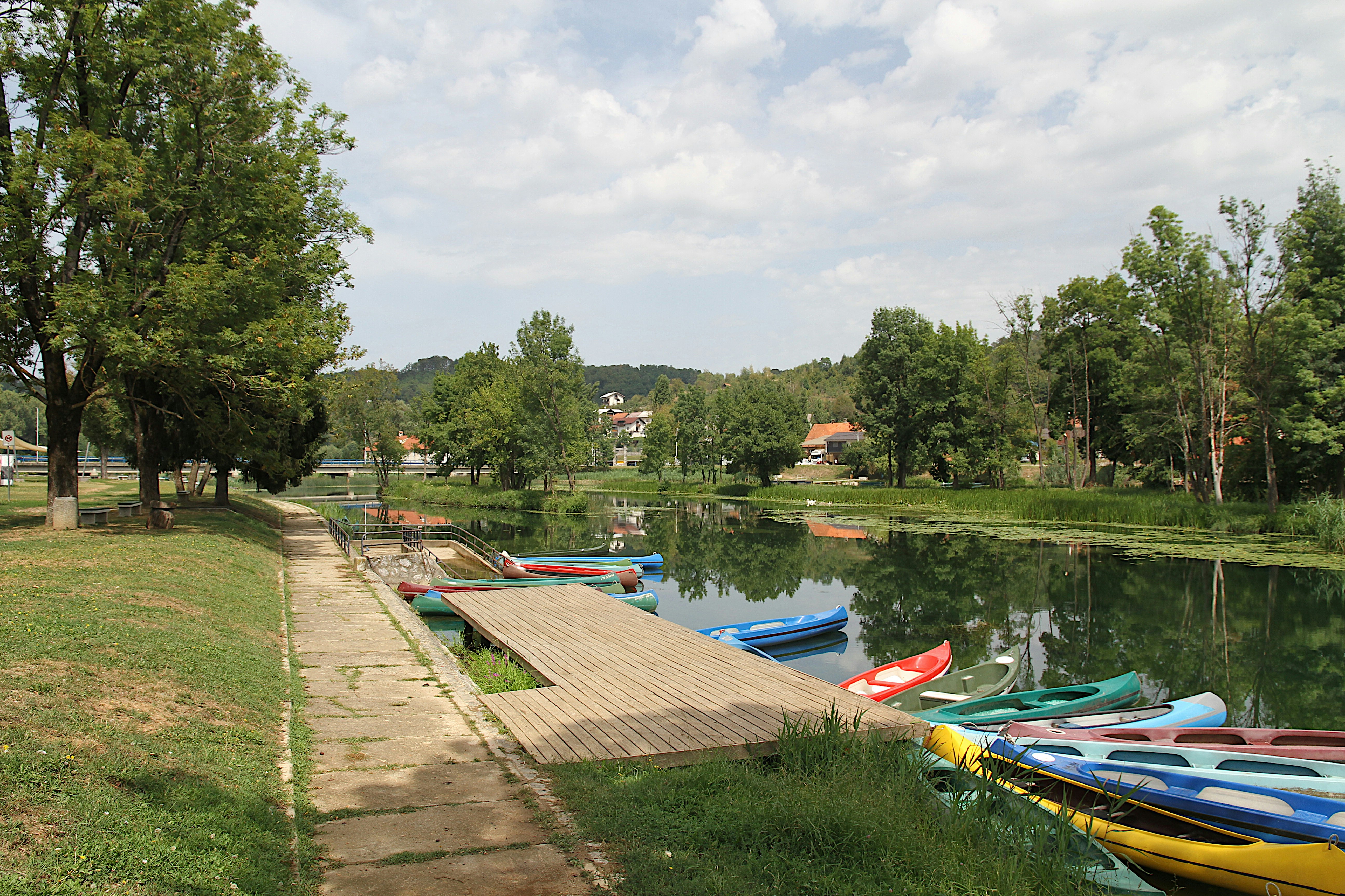 a dock with boats on it by a body of water