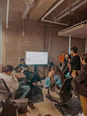 A professional setting where a leader is actively engaging with their team.