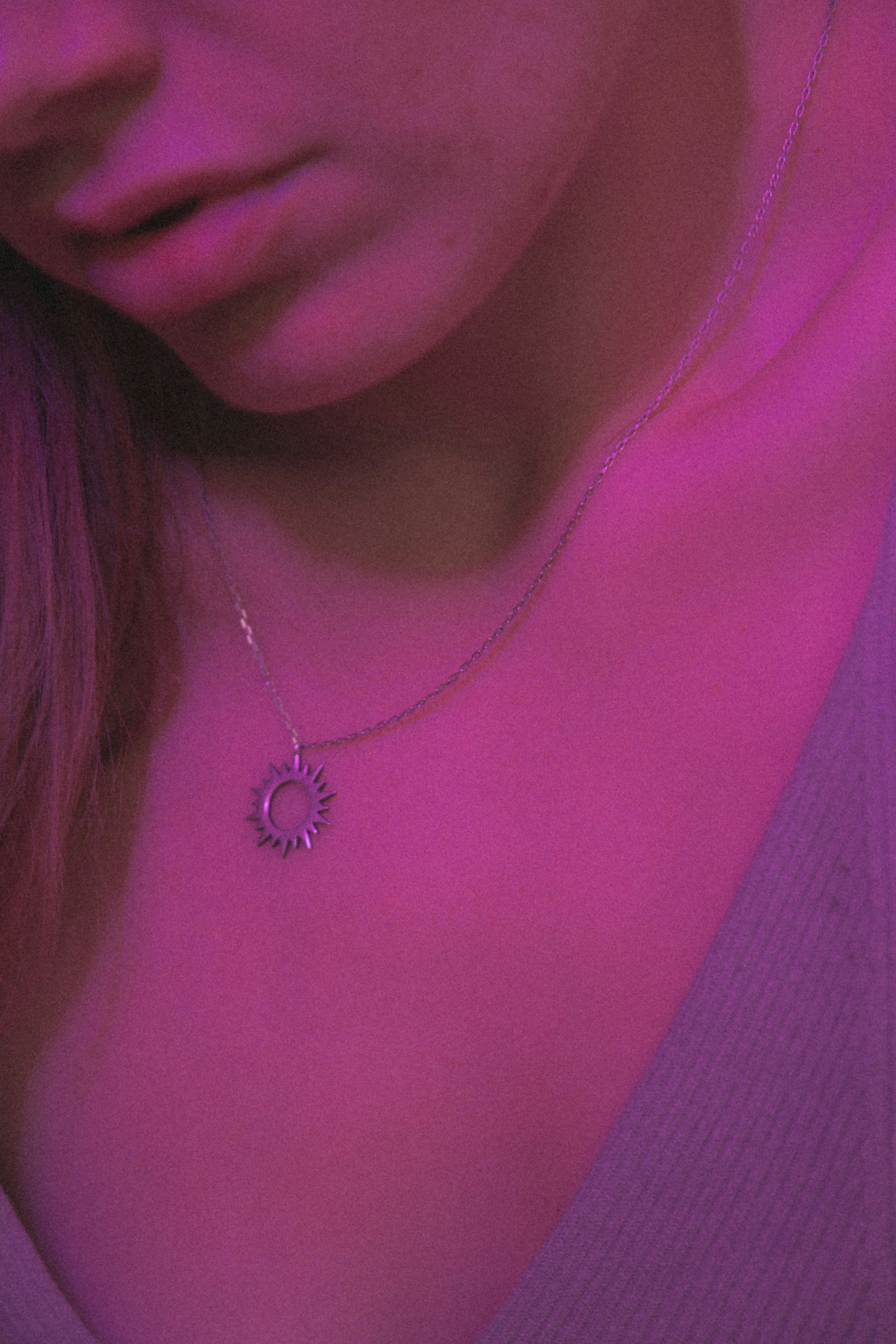 a woman wearing a necklace